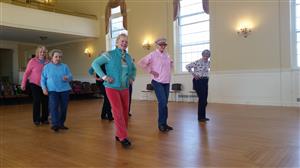 Fitness Instructor Mary Root leads members of her Line Dancing class, at Simsbury Senior Center.